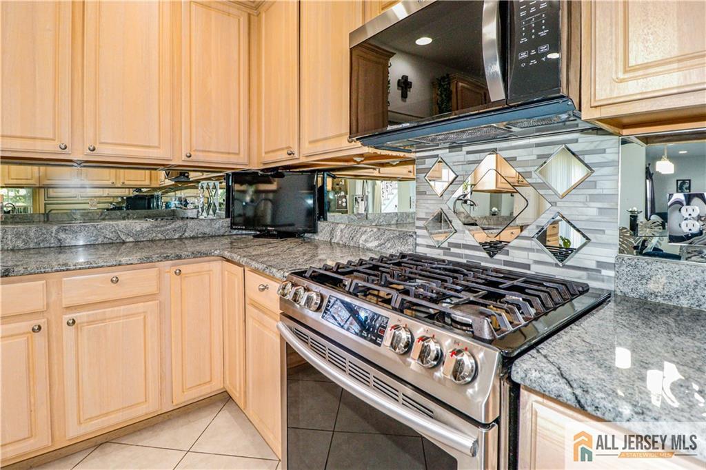 11 Markham Circle Old Bridge, NJ 08857 - Photo 14 of 61 a kitchen with granite countertop a stove and a sink