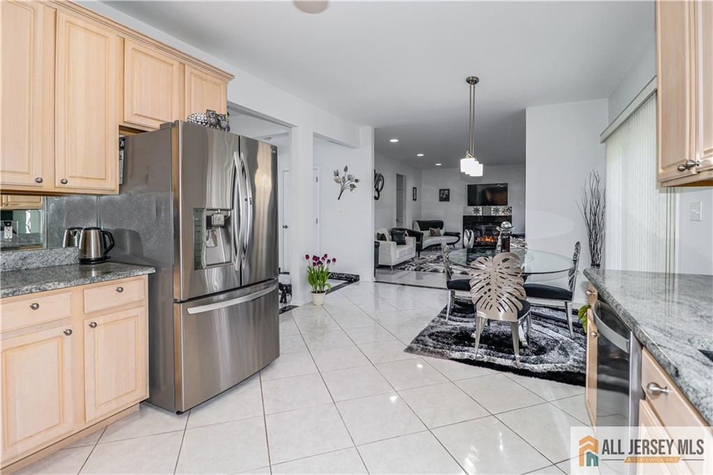 11 Markham Circle Old Bridge, NJ 08857 - Photo 15 of 61 a kitchen with refrigerator and cabinets