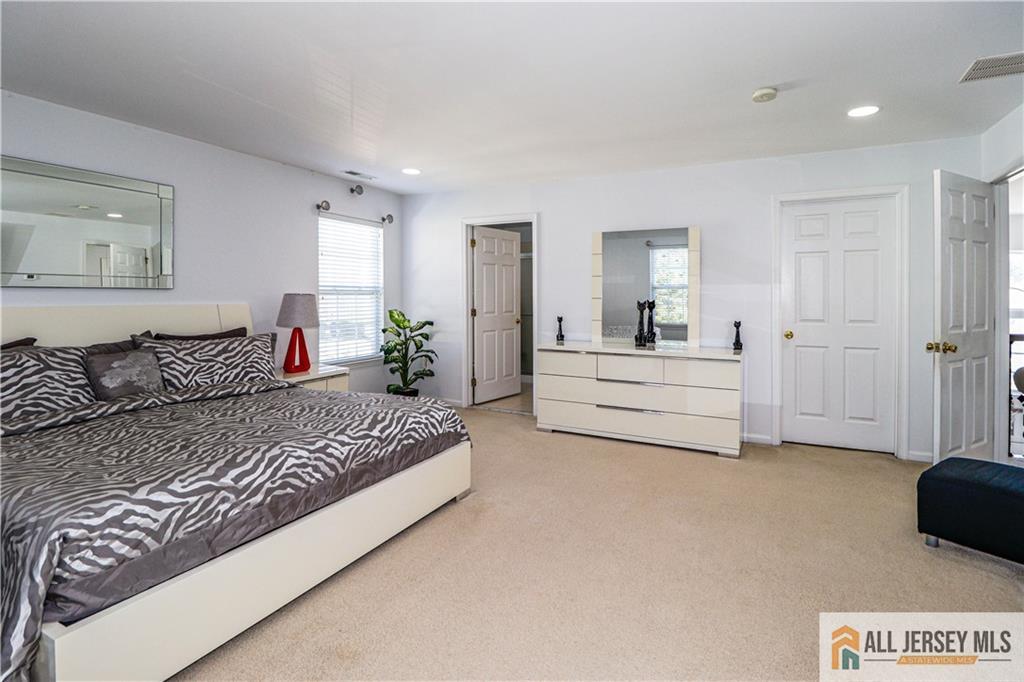 11 Markham Circle Old Bridge, NJ 08857 - Photo 19 of 61 a spacious bedroom with a bed and cabinet