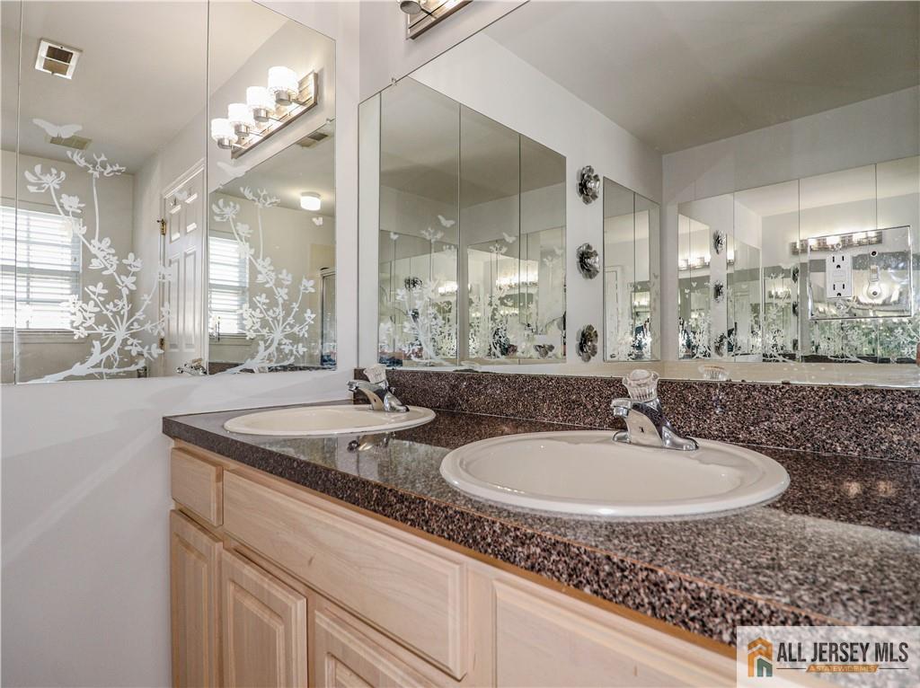 11 Markham Circle Old Bridge, NJ 08857 - Photo 23 of 61 a bathroom with a sink and a mirror