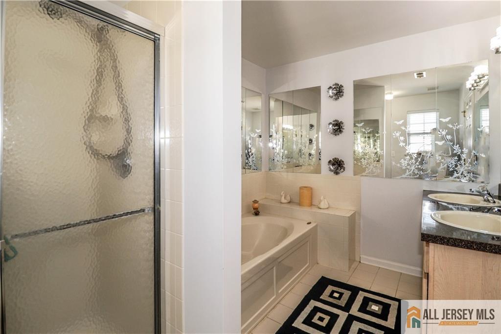 11 Markham Circle Old Bridge, NJ 08857 - Photo 24 of 61 a bathroom with a tub sink and mirror