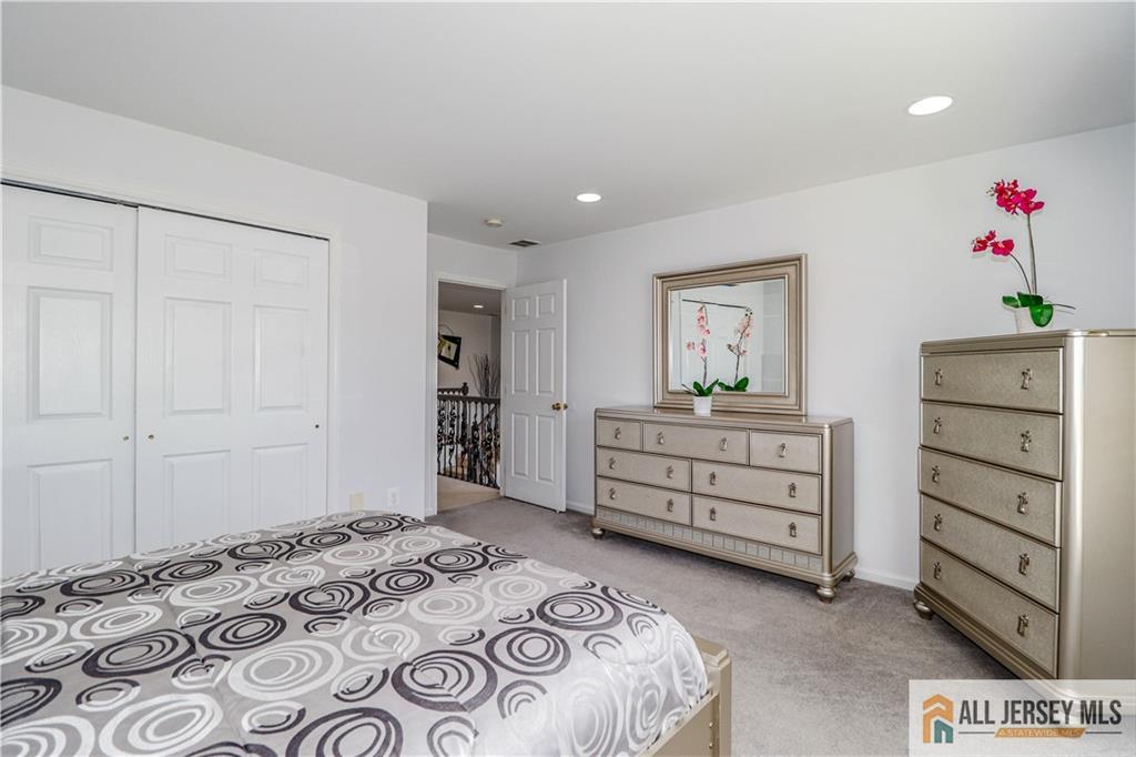 11 Markham Circle Old Bridge, NJ 08857 - Photo 26 of 61 a bedroom with a bed and a dresser in it