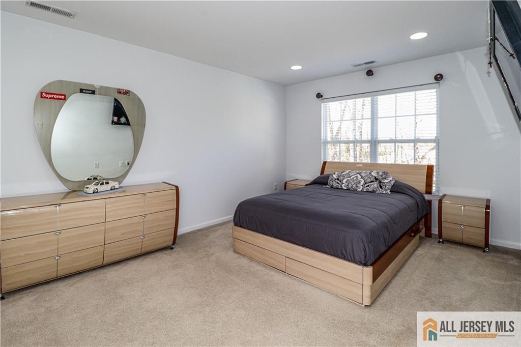 11 Markham Circle Old Bridge, NJ 08857 - Photo 29 of 61 a bedroom with a bed and a dresser