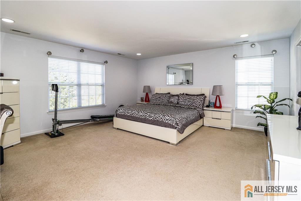 11 Markham Circle Old Bridge, NJ 08857 - Photo 30 of 61 a living room with furniture a bed and a potted plant