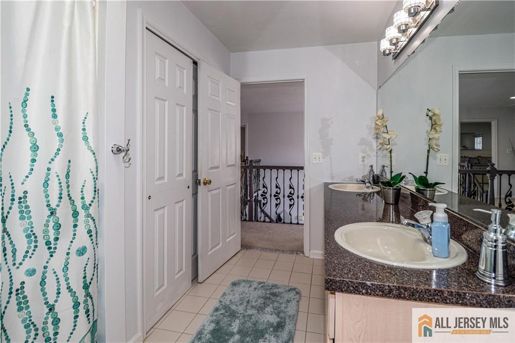 11 Markham Circle Old Bridge, NJ 08857 - Photo 34 of 61 a bathroom with a sink and a mirror