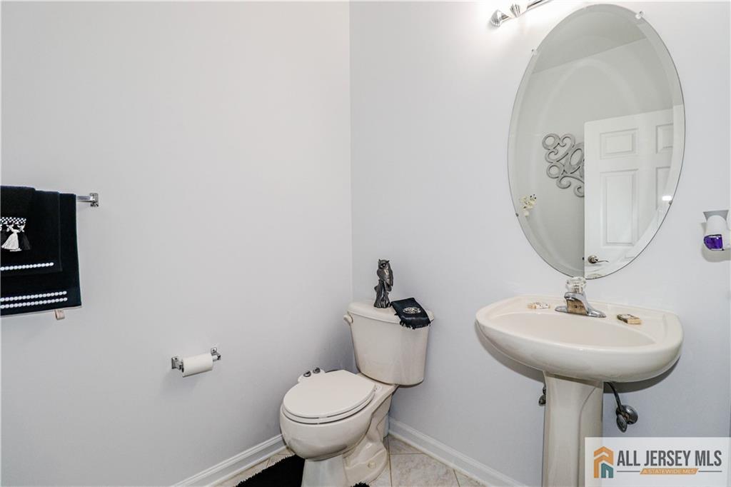 11 Markham Circle Old Bridge, NJ 08857 - Photo 35 of 61 a bathroom with a toilet sink and mirror