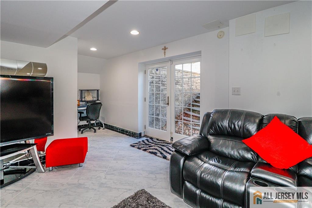 11 Markham Circle Old Bridge, NJ 08857 - Photo 40 of 61 a bedroom with furniture and a flat screen tv