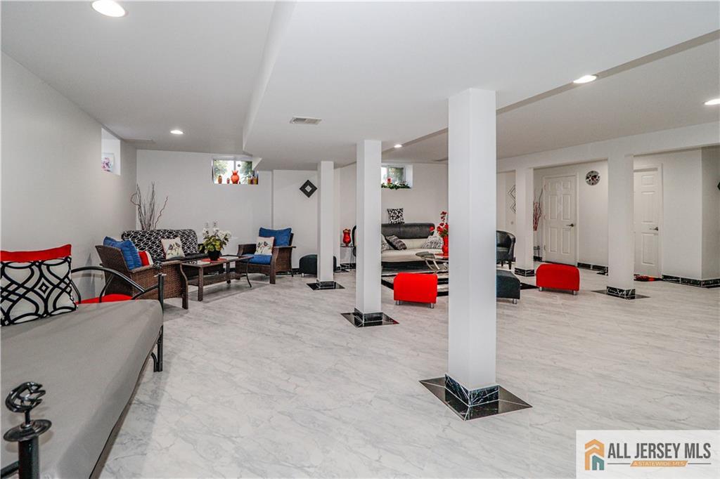 11 Markham Circle Old Bridge, NJ 08857 - Photo 41 of 61 a view of a room with gym equipment and a flat screen tv