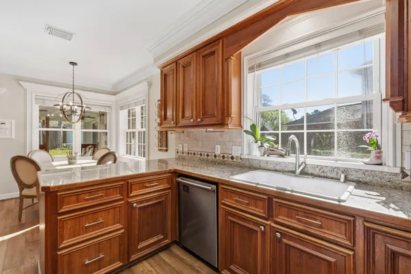 a kitchen with a sink and a window