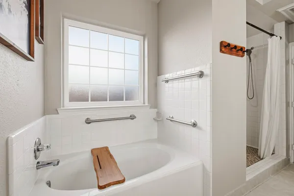 a white bath tub sitting next to a window