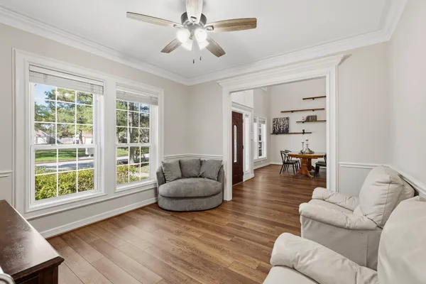 a view of a dining room with furniture and window