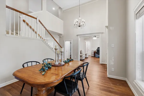 a view of a dining room with furniture and wooden floor