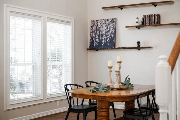 a view of a dining room with furniture and window