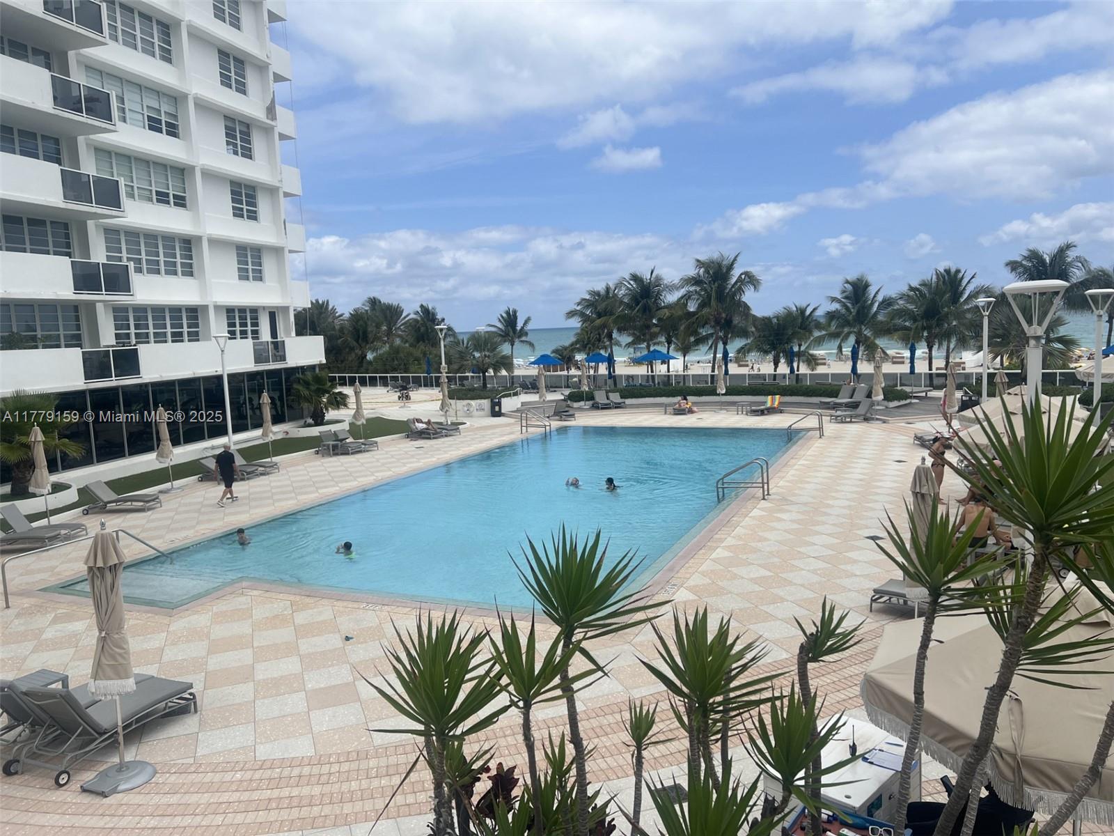 100 Lincoln Road, Unit 430 Miami Beach, FL 33139 - Photo 11 of 21 a view of a swimming pool next to a building