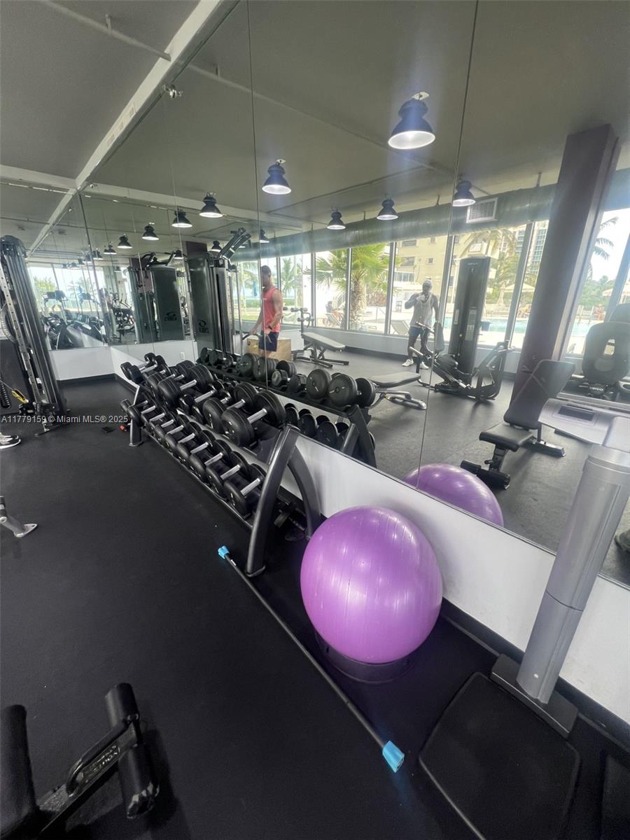 100 Lincoln Road, Unit 430 Miami Beach, FL 33139 - Photo 13 of 21 a room with gym equipment