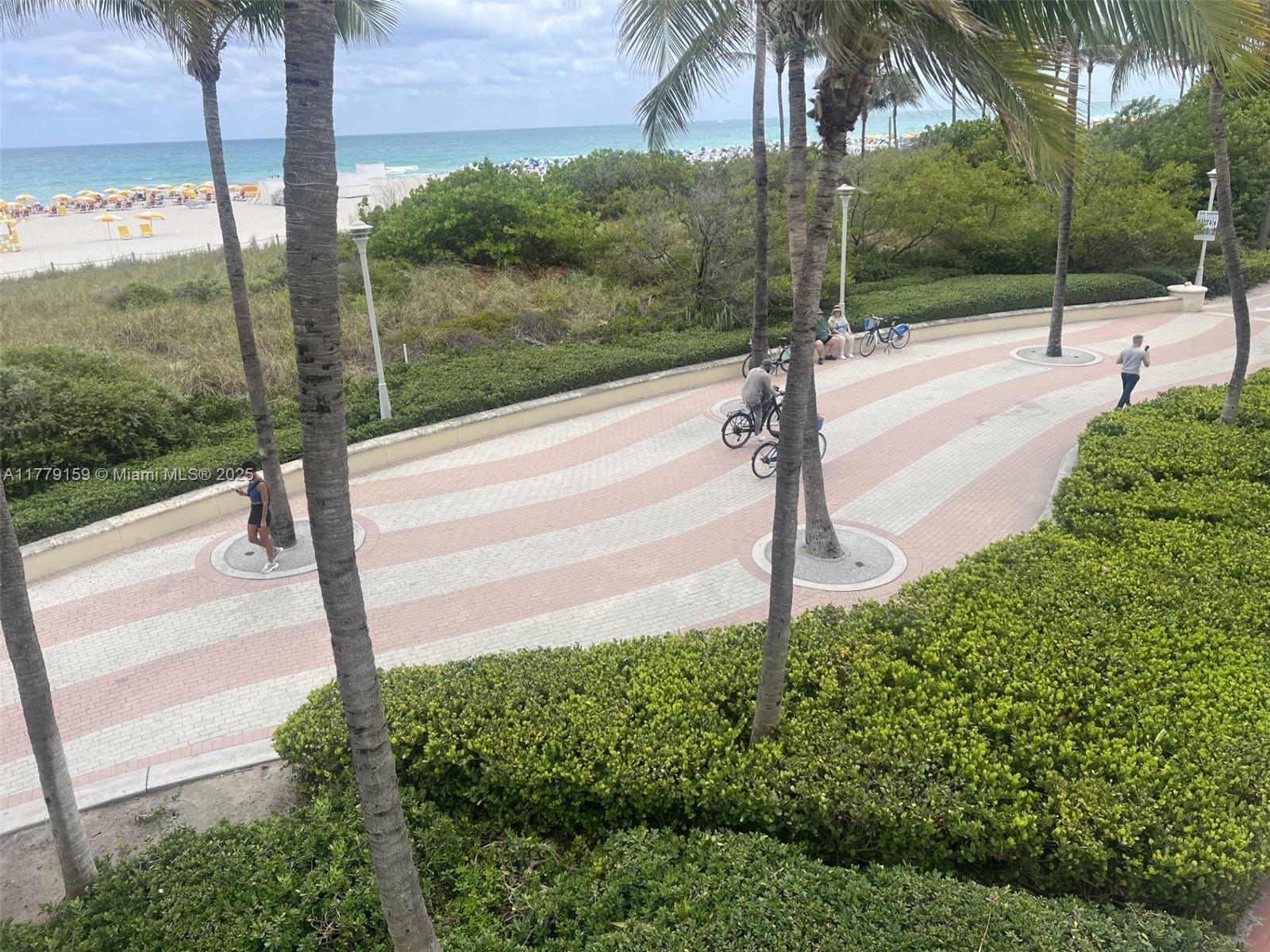 100 Lincoln Road, Unit 430 Miami Beach, FL 33139 - Photo 20 of 21 a view of a street with a building in front of it