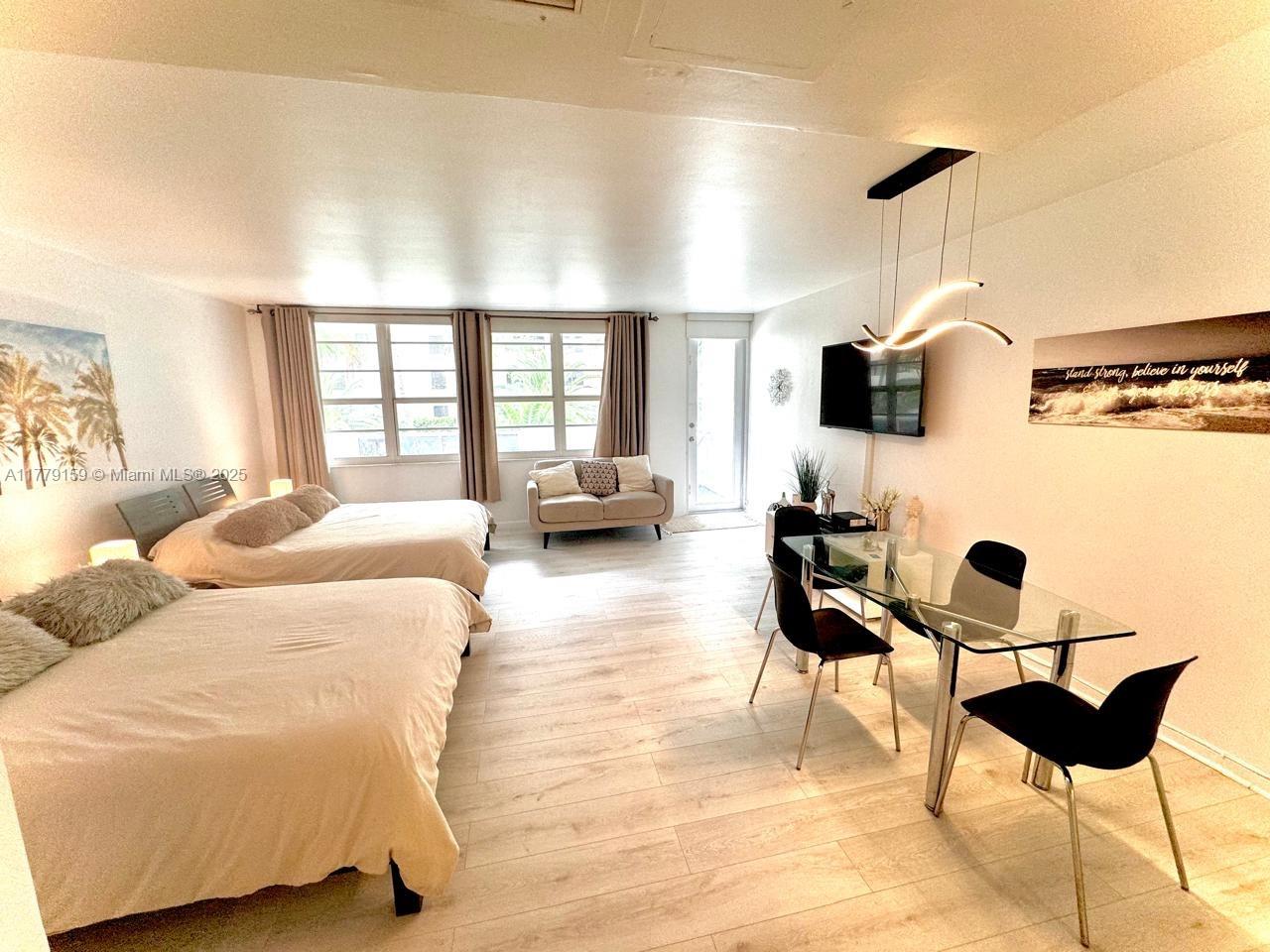 100 Lincoln Road, Unit 430 Miami Beach, FL 33139 - Photo 7 of 21 a living room with furniture and a flat screen tv