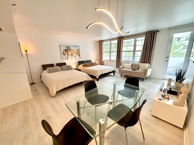 a view of a livingroom with furniture and entryway