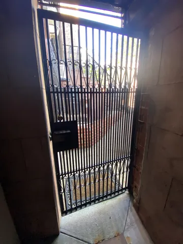 a front view of a brick building with many windows