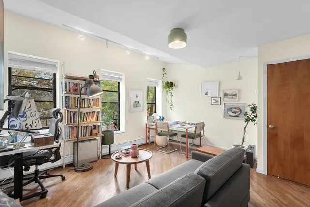 a kitchen with stainless steel appliances a stove a sink and cabinets