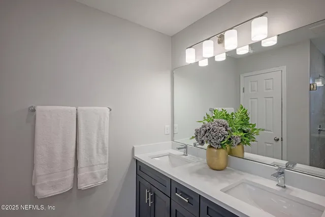 a bedroom with a bed and a lamp