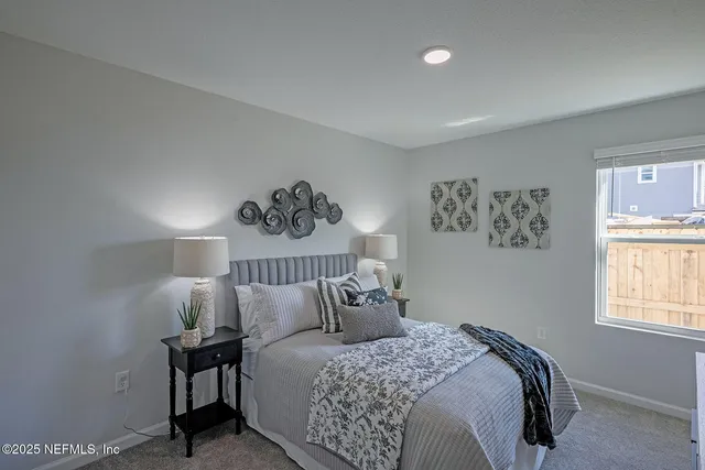 a bed room with a bed and a window