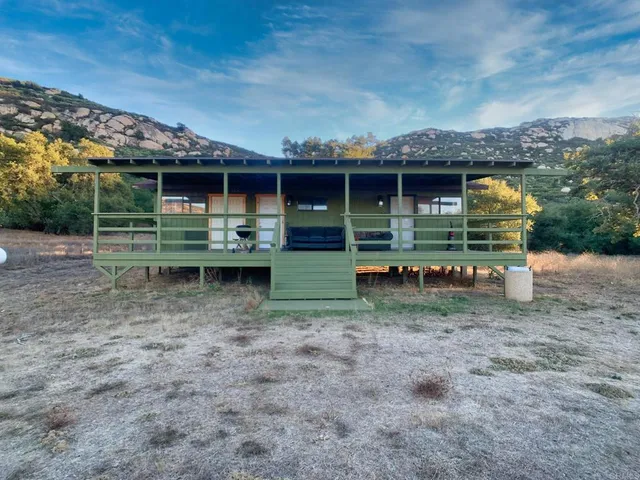 a view of a back yard of a house