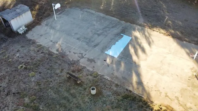 a view of a livingroom with furniture window and a fireplace