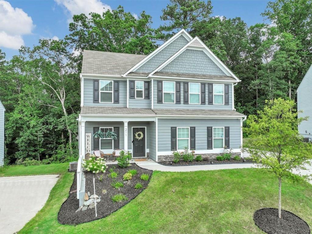 211 Shoals Bridge Road Acworth, GA 30102 - Photo 1 of 1 a front view of a house with a yard