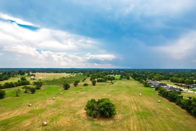 a view of a lake with a big yard
