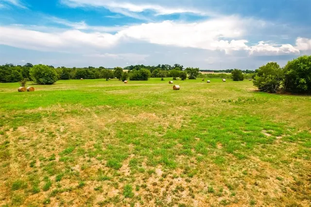 a view of a lake with houses in the back