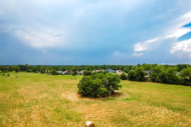 a view of an ocean and a yard