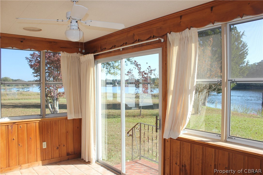 1050 Tick Neck Road Cardinal, VA 23025 - Photo 23 of 47 a view of a porch with a floor to ceiling window