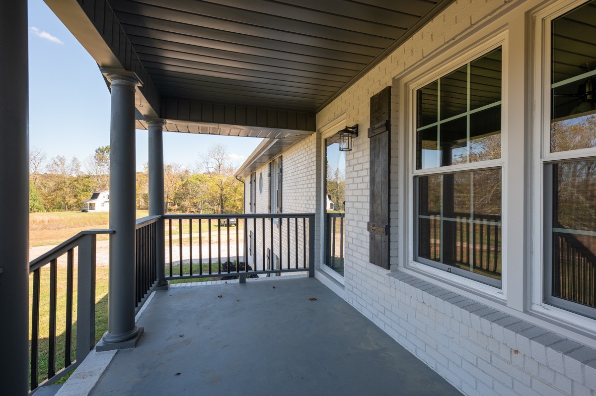 300 Garrison Branch Road Cottontown, TN 37048 - Photo 11 of 50 a view of a porch with wooden floor and outdoor space