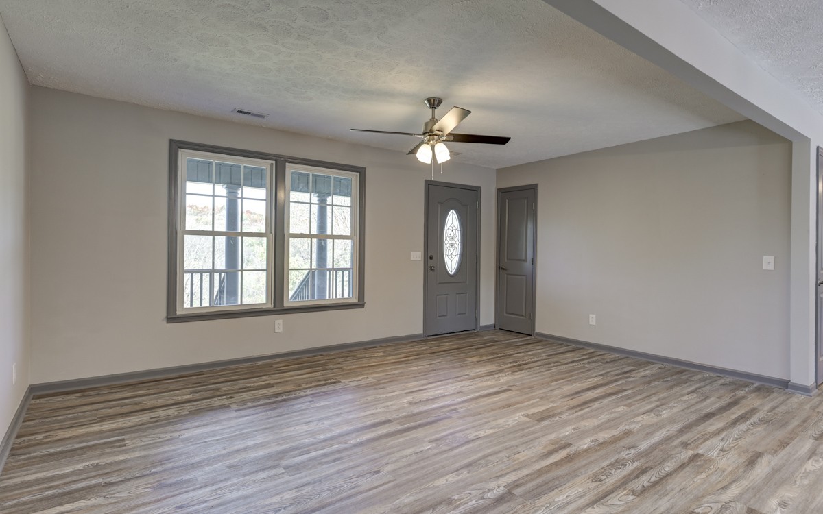 300 Garrison Branch Road Cottontown, TN 37048 - Photo 14 of 50 wooden floor in an empty room with a window