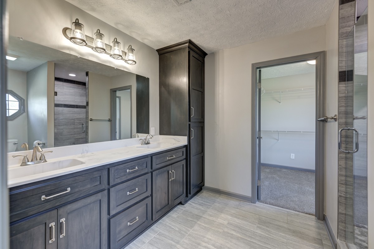 300 Garrison Branch Road Cottontown, TN 37048 - Photo 26 of 50 a spacious bathroom with a double vanity sink shower and a mirror