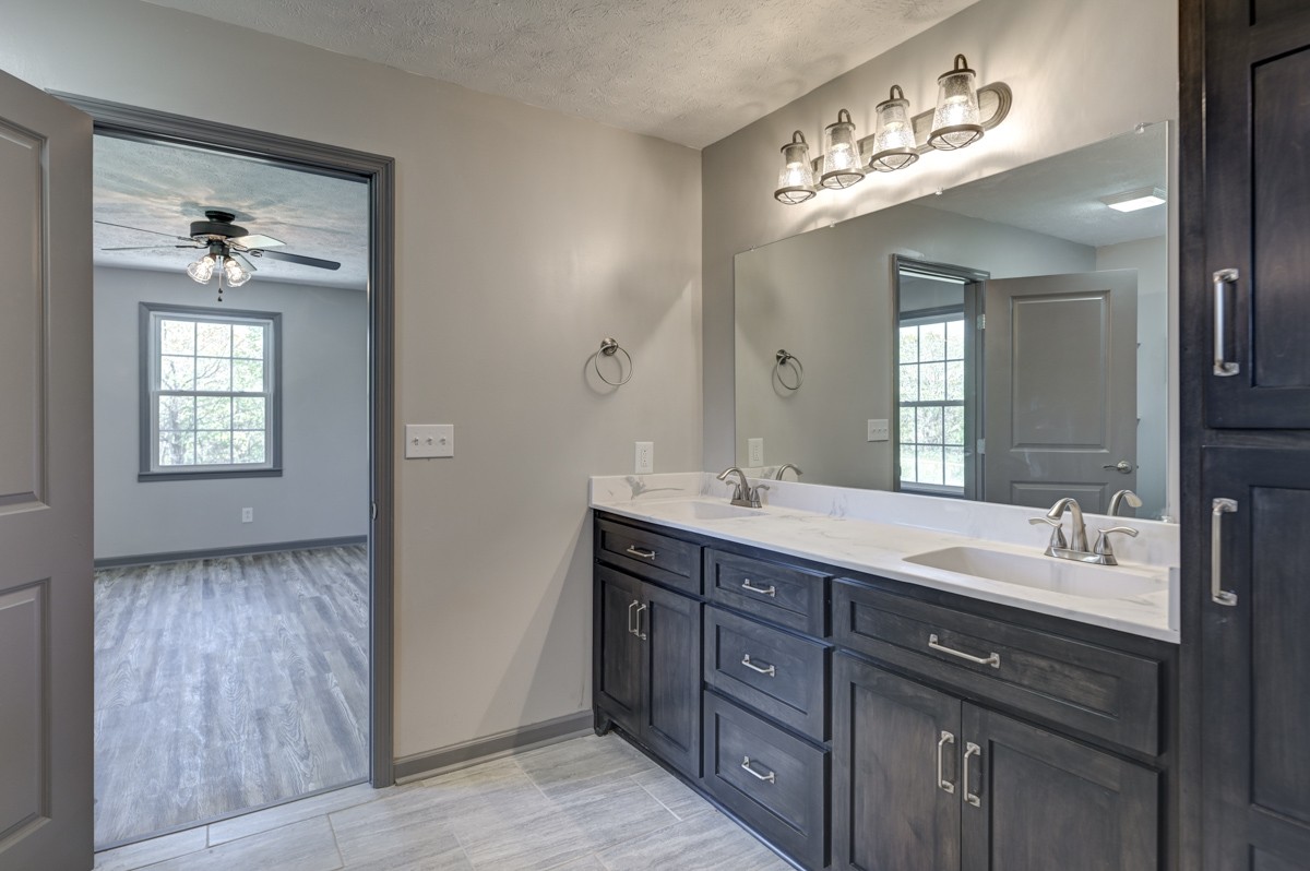 300 Garrison Branch Road Cottontown, TN 37048 - Photo 27 of 50 a spacious bathroom with a double vanity sink and a mirror