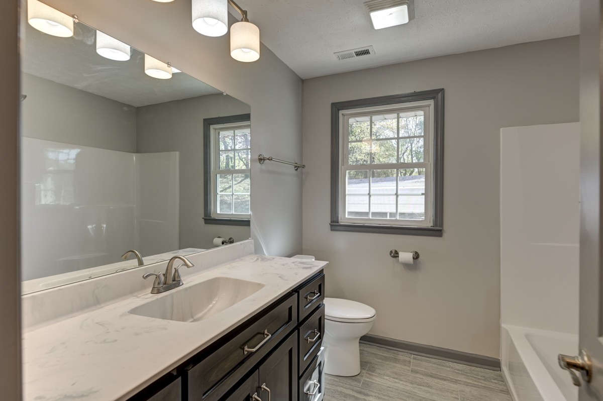 300 Garrison Branch Road Cottontown, TN 37048 - Photo 31 of 50 a bathroom with a sink and a toilet