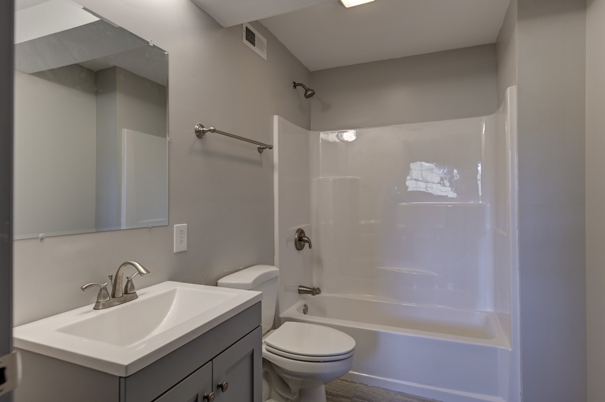 300 Garrison Branch Road Cottontown, TN 37048 - Photo 37 of 50 a bathroom with a sink toilet and shower