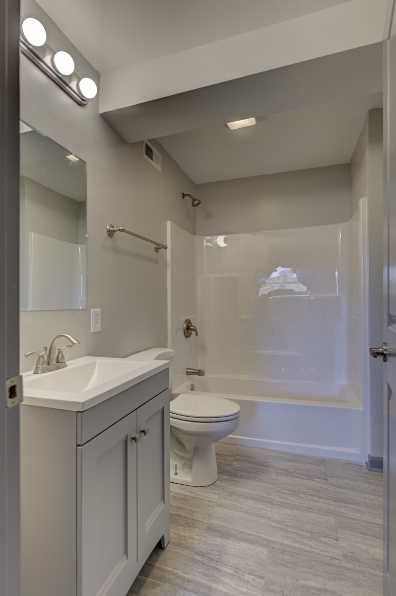 300 Garrison Branch Road Cottontown, TN 37048 - Photo 38 of 50 a bathroom with a sink a toilet and shower