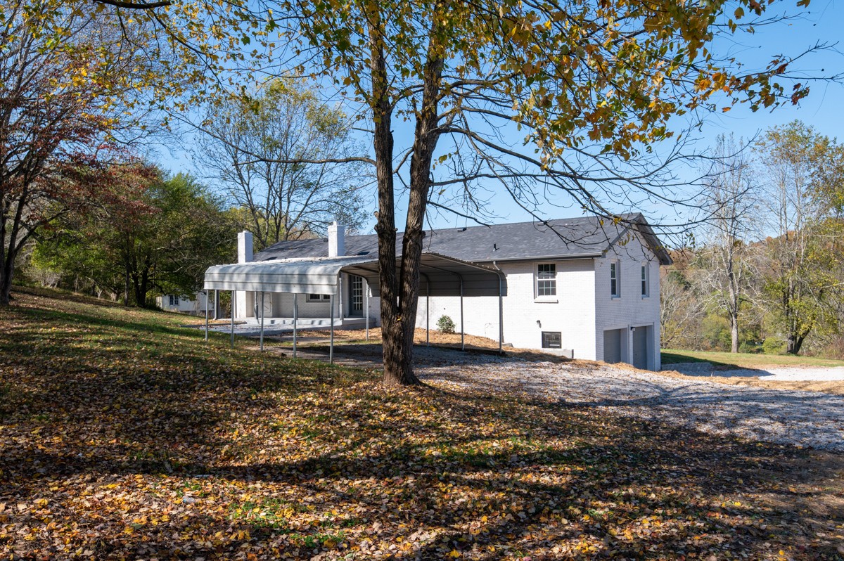 300 Garrison Branch Road Cottontown, TN 37048 - Photo 39 of 50 a view of a house with a yard