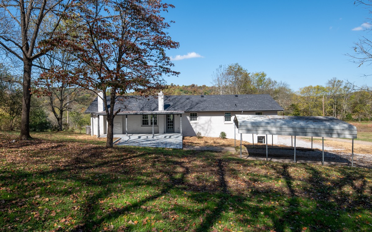 300 Garrison Branch Road Cottontown, TN 37048 - Photo 40 of 50 a view of a house with a backyard