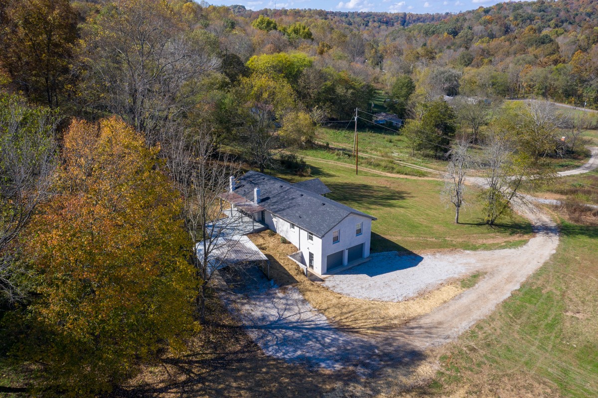 300 Garrison Branch Road Cottontown, TN 37048 - Photo 44 of 50 a view of a house with a yard