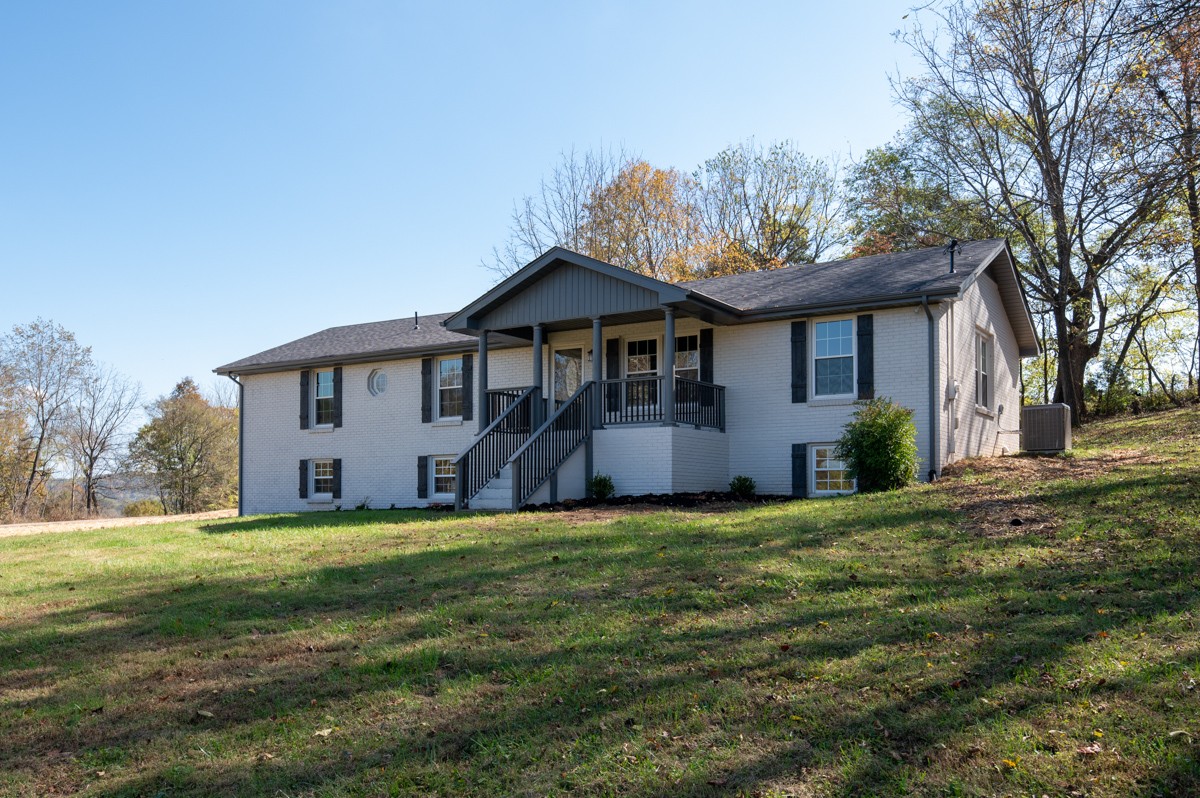 300 Garrison Branch Road Cottontown, TN 37048 - Photo 9 of 50 a view of a house with a yard