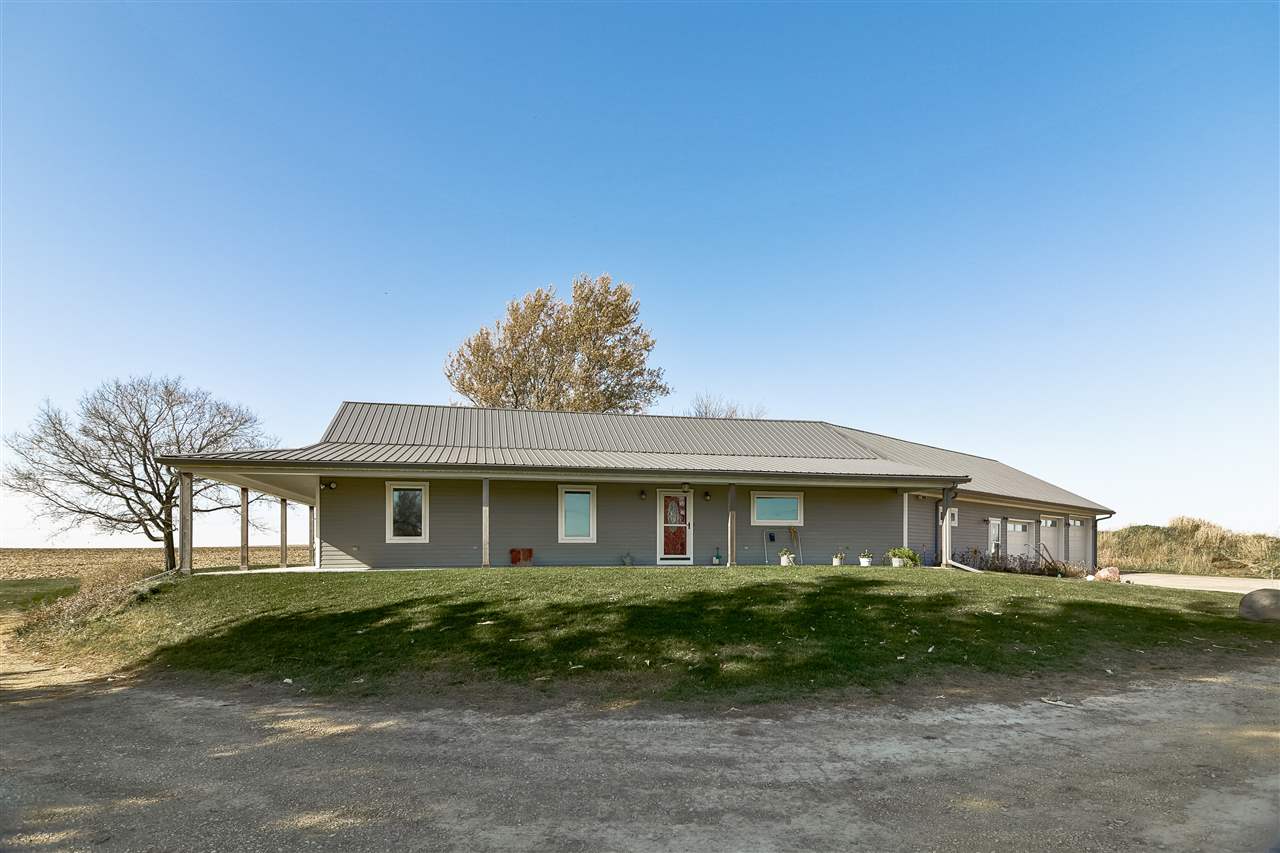5776 Daysville Road Oregon, IL 61061 - Photo 1 of 34 a front view of a house with a garden