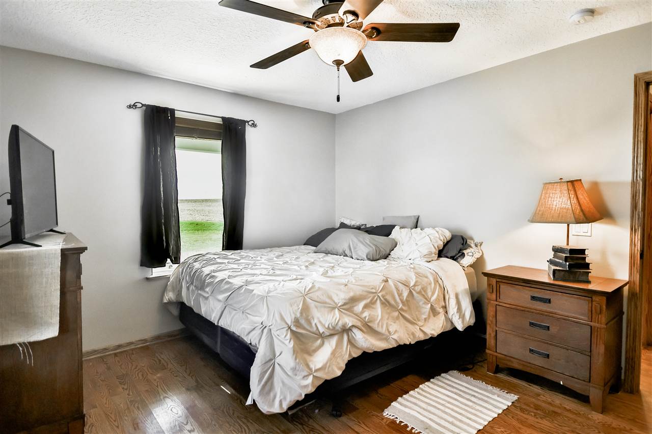 5776 Daysville Road Oregon, IL 61061 - Photo 23 of 34 a bedroom with a bed dresser and a window