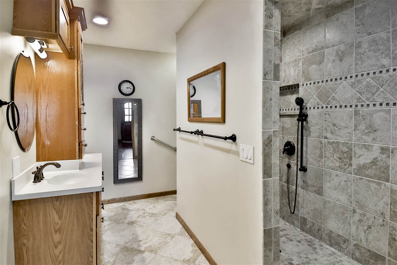 5776 Daysville Road Oregon, IL 61061 - Photo 26 of 34 a bathroom with a sink a mirror and shower