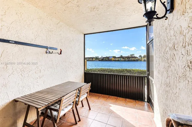a view of a balcony with furniture