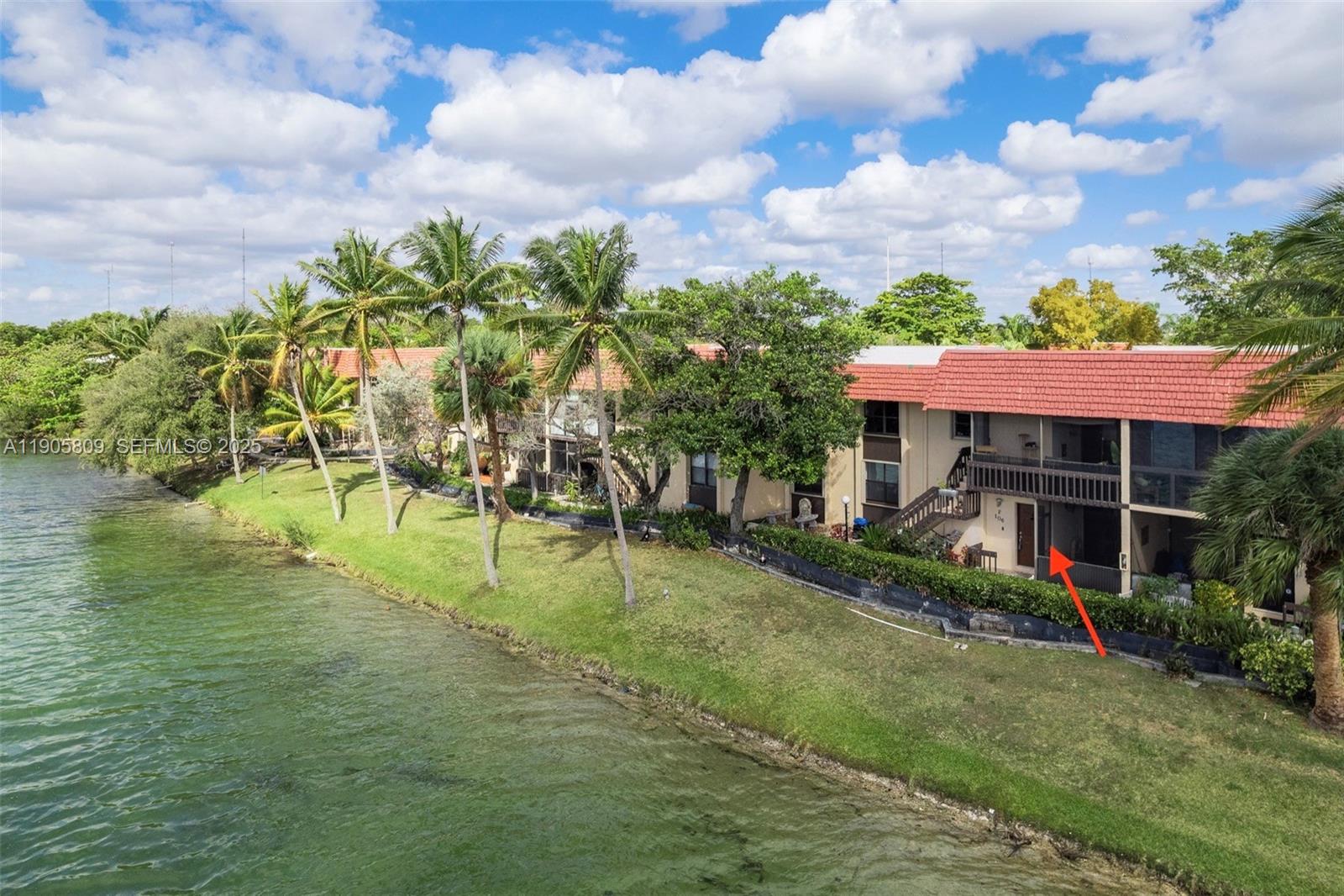 770 Northeast 199th Street, Unit 106F Miami, FL 33179 - Photo 12 of 25 a view of a house with a yard