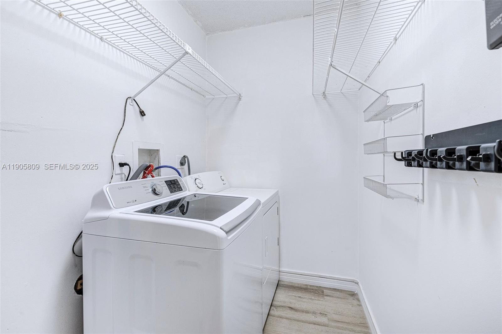 770 Northeast 199th Street, Unit 106F Miami, FL 33179 - Photo 19 of 25 a bathroom with a sink and vanity